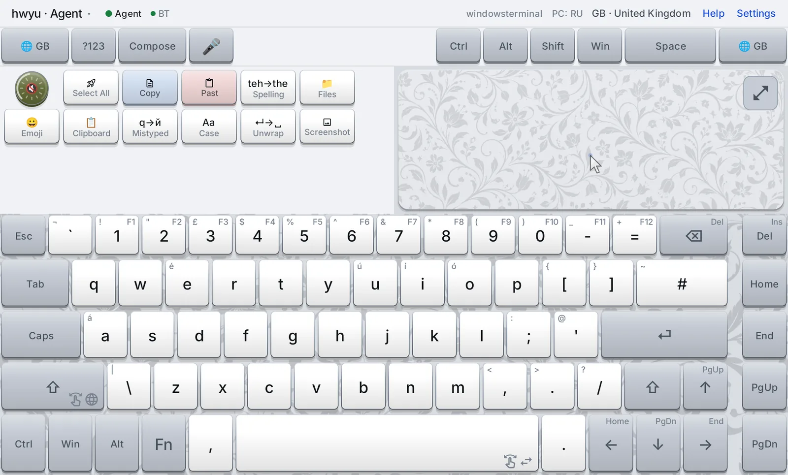 The Standinkey keyboard on a tablet: a status line, a row of controls, a tray of buttons, a small mouse pad, and a full keyboard with function keys on the digits.